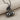 Twin Cherry Pendant, black rhodium, angled view on fabric