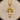 Close-up of gold vermeil Cross of Lorraine pendant resting on wood slice highlighting the detailed craftsmanship