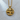 Close-up of polished Libra zodiac pendant resting on a light textured wooden surface highlighting its premium craftsmanship