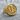 Detailed letter I signet ring with ornate vintage filigree resting on a textured wooden surface, showing craftsmanship