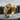 Close-up of the handcrafted Cayman crocodile ring resting on a wood slice, highlighting the detailed snout and stones.