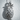 Tropical Pineapple Pendant, polished silver, front view on textured background