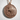 Egyptian Queen Pendant, rose gold, product photo on textured surface