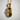Close-up of the handcrafted baby shoe pendant highlighting its smooth metallic finish and detailed interior design.