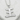 King Kanji Pendant, polished silver, front view on textured stone