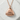 Smiling Onigiri Pendant, rose gold finish, front view on stone
