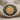 Close-up of 925 sterling silver Helios coin ring showing the beaded frame and raised sun god relief on linen fabric
