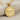 Close-up view of the 925 sterling silver Hittite seal pendant resting on textured fabric showing hammered finish