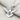 Peace Dove Pendant, polished silver, angled view on fabric