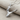 Ballet Dancer Pendant, polished silver, angled product photo on fabric