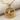 Sailboat Wave Pendant, gold vermeil, front view on fabric
