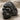 Mountain Gorilla Ring, black rhodium, angled three-quarter view on fabric