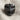 Lobotomy Skull Ring, black rhodium, front view on textured fabric