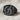 Star of Bethlehem Nativity Ring in black rhodium, front view on linen fabric