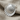 Scallop Shell Earring, polished finish, angled view on fabric