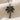 Palm tree pendant, black rhodium plated, front view on fabric