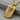 Memento Mori Dog Tag Pendant, gold vermeil, angled front view on stone