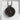Garnet Seed Pomegranate Pendant in black rhodium, front view on display pedestal