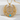 Full view of the Hecate crescent pendant and chain resting elegantly on a textured white stone background