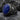 Lapis Anchor Ring in black rhodium, side angle on stone slab