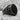 Airborne Onyx Ring, black rhodium, angled side view on rock