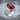 Oval Masonic Carnelian Ring, polished, side angle view on stone surface