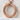 Scaled Ouroboros Dragon Pendant, rose gold, angled front view on stone pedestal