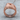 Abstract Merger Ring in rose gold plated silver, front view on wood