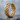 Woven Celtic Knot Ring, gold vermeil, product photo on stone surface