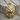 Flowing Mane Lion Pendant, gold vermeil, product photo on wood base