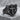 Cross Shield Ring, black rhodium, angled perspective on stone surface