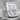 Saints Peter and Paul ring, polished silver, angled front view on stone