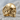 Tribal Skull Ring, gold vermeil, product photo on stone surface