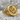 Masonic Square and Compass Ring, gold vermeil, product photo on stone surface