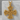 Celtic knot cross pendant, gold vermeil, product view on stone block