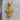 Orthodox Archangel Cross Pendant, gold vermeil, front view on stone block
