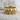Catacomb skull ring in gold vermeil on stone background