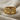 Last Supper Communion Ring, gold vermeil, front view on fabric