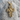 Christ Profile Cross Pendant, gold vermeil, front view resting on stone