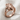 Anatomical Heart Ring in rose gold, angled product photo on linen fabric