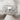 Skull Rose Band Ring, polished silver, angled product photo on fabric