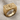 SOA Skull Ring, gold vermeil, angled front view on fabric