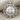 Celestial Sun Face Pendant, polished silver, front view on fabric