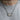 Model wearing the oxidized sterling silver et in arcadia ego bar necklace on a horizontal curb chain