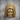 Chief Feather Headdress Ring, gold vermeil, front view on wood