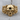 Scroll Skull Ring, gold vermeil, front product view on wood