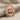 North Star Compass Pendant, rose gold, front view on stone block