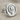 Hittite Sun Disk Earring, polished silver, angled front view