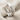 Entwined Branch Ring, polished silver, three-quarter view on linen