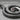 Spiral Serpent Pendant, angled close-up showing hand-finished texture